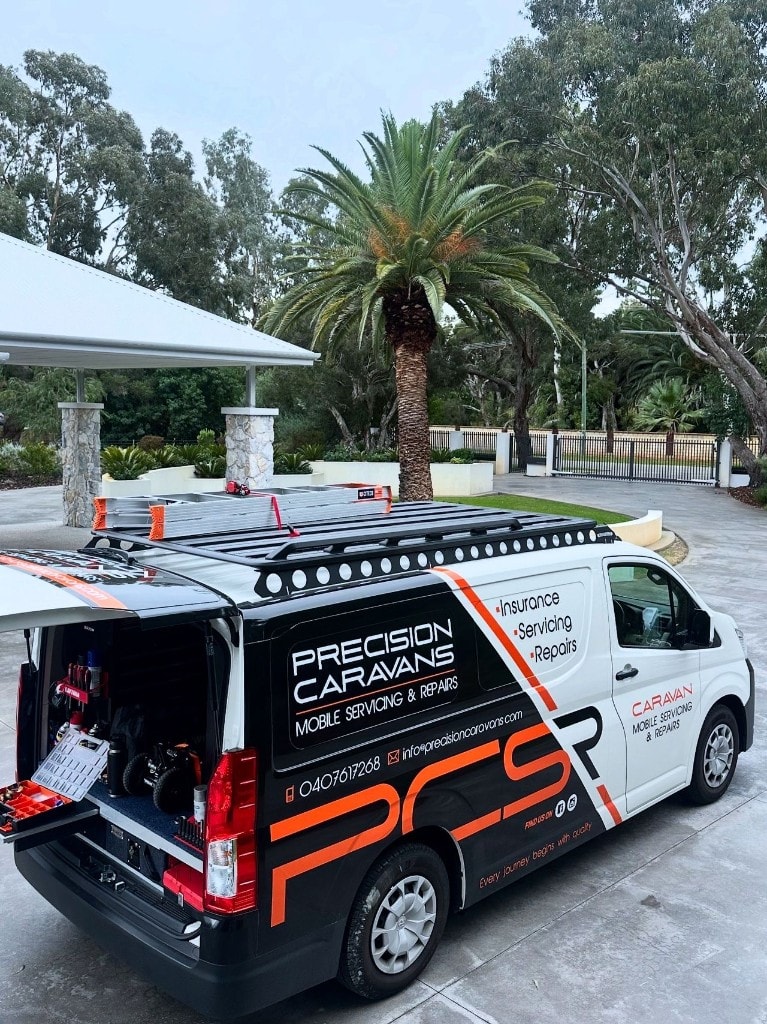 Precision Caravans technician performing professional mobile caravan service inside a caravan